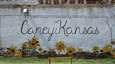 Caney, Kansas mural with sunflowers painted on a wall 