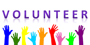 Volunteer with clip art multicolored hands raised in the air